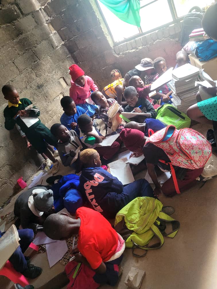 Children with donated stationery and books